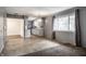 Open-concept layout featuring a living room seamlessly connected to the adjacent kitchen at 8103 Rumford Rd, Indianapolis, IN 46219