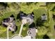Aerial view of beautiful home showcasing pristine lawn and mature trees at 839 Pebble Brook Pl, Noblesville, IN 46062