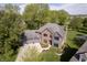 Beautiful brick home with lush green landscaping and a three-car garage at 839 Pebble Brook Pl, Noblesville, IN 46062