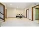 Spacious basement with carpet flooring and a drum set ready for band practice at 839 Pebble Brook Pl, Noblesville, IN 46062