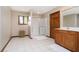 Bathroom with tiled floor, light wood cabinets, and a shower at 839 Pebble Brook Pl, Noblesville, IN 46062