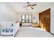 Bright bedroom with a crib, window with natural light, and a cozy beanbag chair at 839 Pebble Brook Pl, Noblesville, IN 46062
