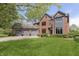 Charming brick two-story home featuring a well-manicured lawn and a three-car garage at 839 Pebble Brook Pl, Noblesville, IN 46062