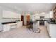 Spacious kitchen featuring white cabinets, a large island, and stainless steel appliances at 839 Pebble Brook Pl, Noblesville, IN 46062