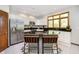 Kitchen featuring white cabinets, dark countertops, stainless steel appliances, and a center island at 839 Pebble Brook Pl, Noblesville, IN 46062