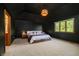 Large main bedroom features a dark accent wall, neutral carpet, and view to the backyard at 839 Pebble Brook Pl, Noblesville, IN 46062