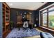 Home office featuring wood floors, a modern desk, and large windows at 839 Pebble Brook Pl, Noblesville, IN 46062