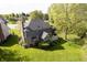 Aerial view of backyard showing deck, enclosed porch, and a sprawling lawn at 839 Pebble Brook Pl, Noblesville, IN 46062