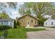 A nice backyard offers a concrete patio and a table with chairs, perfect for relaxation at 944 N Harbison Ave, Indianapolis, IN 46219