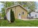 A nice backyard offers a concrete patio and a table with chairs, perfect for relaxation at 944 N Harbison Ave, Indianapolis, IN 46219