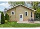 A nice backyard offers a concrete patio and a table with chairs, perfect for relaxation at 944 N Harbison Ave, Indianapolis, IN 46219