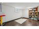 Spacious basement area with dark wood floors, a small window and room for storage at 944 N Harbison Ave, Indianapolis, IN 46219