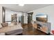Finished basement with an entertainment center, stairs, and water heater at 944 N Harbison Ave, Indianapolis, IN 46219