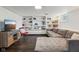 Finished basement with a couch, entertainment center, and built-in shelves at 944 N Harbison Ave, Indianapolis, IN 46219