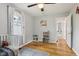 Bright Bedroom features hardwood floors, area rug, and a white crib at 944 N Harbison Ave, Indianapolis, IN 46219