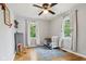 Bedroom with ample sunlight, hardwood floors, and a blue patterned rug at 944 N Harbison Ave, Indianapolis, IN 46219