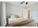 Bedroom with hardwood floors, white walls and a large window at 944 N Harbison Ave, Indianapolis, IN 46219