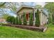 A cozy home with a front porch, new landscaping, and traditional design elements at 944 N Harbison Ave, Indianapolis, IN 46219
