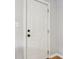 Interior doorway with white trim, paneled door, and sleek hardware at 944 N Harbison Ave, Indianapolis, IN 46219