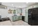 Bright kitchen boasts stainless steel appliances, updated cabinetry and countertops at 944 N Harbison Ave, Indianapolis, IN 46219