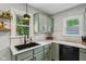 A kitchen featuring light countertops, cabinetry and stainless appliances at 944 N Harbison Ave, Indianapolis, IN 46219