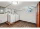Bright laundry room with white washer and dryer and a window for natural light at 944 N Harbison Ave, Indianapolis, IN 46219