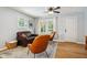 Cozy living area with hardwood floors, contemporary furnishings, and bright windows at 944 N Harbison Ave, Indianapolis, IN 46219