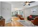Inviting living room with hardwood floors, stylish furniture, and seamless flow to the kitchen and dining area at 944 N Harbison Ave, Indianapolis, IN 46219
