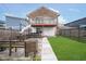 Spacious backyard featuring a covered patio and second-story balcony, offering ample outdoor space for relaxation and entertainment at 1009 Harrison St, Indianapolis, IN 46202