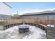 Backyard features a custom circular bench surrounding a fire pit and patio, perfect for outdoor gatherings at 1009 Harrison St, Indianapolis, IN 46202