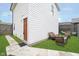 Well-maintained backyard featuring a patio with outdoor seating and a lush lawn, perfect for relaxation and entertaining at 1009 Harrison St, Indianapolis, IN 46202