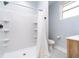 Bathroom with white subway tiled shower, white shower curtain and black and white tile floor at 1009 Harrison St, Indianapolis, IN 46202