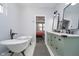 Charming bathroom with a freestanding tub, stylish dual sink vanity, and black hardware at 1009 Harrison St, Indianapolis, IN 46202