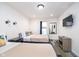 Bedroom with two queen beds, luxury vinyl plank flooring, TV and neutral decor at 1009 Harrison St, Indianapolis, IN 46202