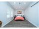 Sunlit bedroom featuring vinyl floors, minimalist decor, bright windows, and cozy accents at 1009 Harrison St, Indianapolis, IN 46202