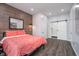 Comfortable bedroom with a barn door leading to the bathroom and modern design elements at 1009 Harrison St, Indianapolis, IN 46202