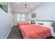 Inviting bedroom with two beds, natural light, vinyl floors, and cozy bedding at 1009 Harrison St, Indianapolis, IN 46202