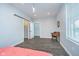 Bright bedroom featuring vinyl floors, and a convenient desk area, offering comfort and functionality at 1009 Harrison St, Indianapolis, IN 46202