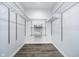 A well-organized walk-in closet features wood-style vinyl flooring and wire shelving for storage at 1009 Harrison St, Indianapolis, IN 46202