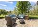 Cozy backyard patio with comfortable outdoor seating and a fire pit, perfect for relaxation at 10504 Ruxton Ct, Fishers, IN 46040