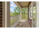 A cozy balcony offers a spot to relax and enjoy the view surrounded by lush greenery at 10504 Ruxton Ct, Fishers, IN 46040