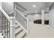 Basement with carpet, neutral walls, black metal stair rail, and plenty of living space at 10504 Ruxton Ct, Fishers, IN 46040