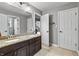 Bathroom with double sinks, granite countertops, and a neutral color palette at 10504 Ruxton Ct, Fishers, IN 46040