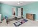 Home gym featuring exercise equipment, light aqua walls, carpet, and natural light at 10504 Ruxton Ct, Fishers, IN 46040