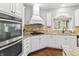 Updated kitchen with white cabinets, granite countertops, and stainless steel appliances at 10504 Ruxton Ct, Fishers, IN 46040