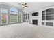 Spacious living room with vaulted ceilings, a fireplace, and large windows offering plenty of natural light at 10504 Ruxton Ct, Fishers, IN 46040