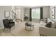Cozy living room featuring neutral colors, large window and elegant decor with a view of entry way at 10504 Ruxton Ct, Fishers, IN 46040