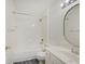 Well-lit bathroom with marble floors, single vanity, and shower-tub combo at 1098 Timber Creek Dr # 2, Carmel, IN 46032