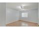 A simply styled room with wood floors and a large window for natural light at 1098 Timber Creek Dr # 2, Carmel, IN 46032