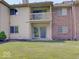 Exterior shot of home with large grassy area, patio and upper deck at 1098 Timber Creek Dr # 2, Carmel, IN 46032